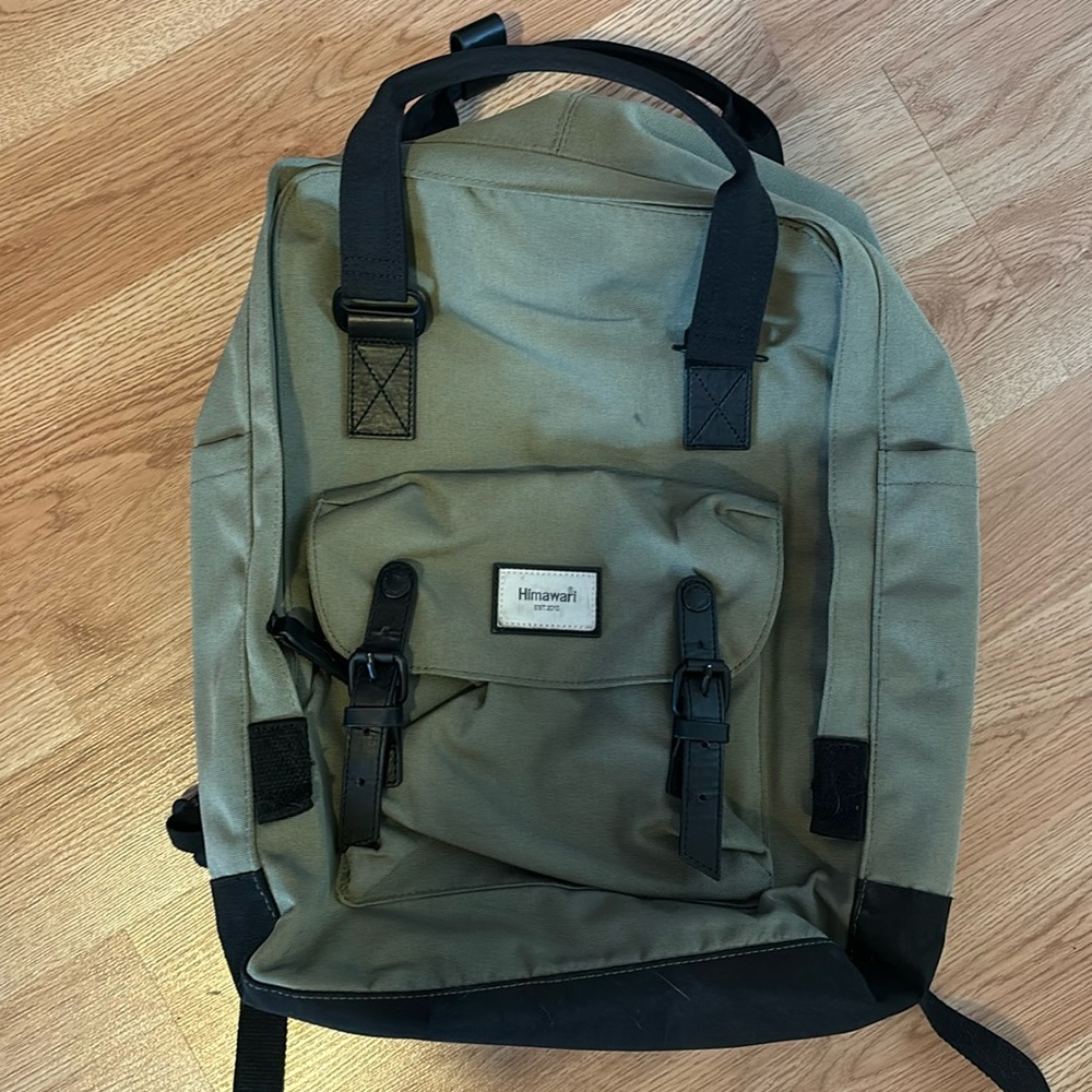 Himawari backpack. Green with black. It’s a backpack for books.